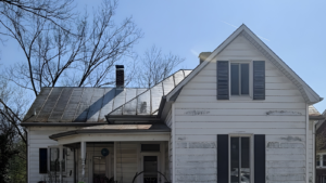 Bathroom fan vent roof damage showing attic moisture mold growth and wood rot caused by improper bathroom exhaust venting in Missouri home