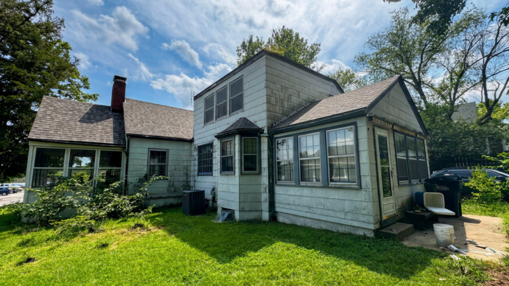 Professional roof inspection older homes in Washington MO showing aging asphalt shingles, flashing, and roof components being evaluated for hidden damage.